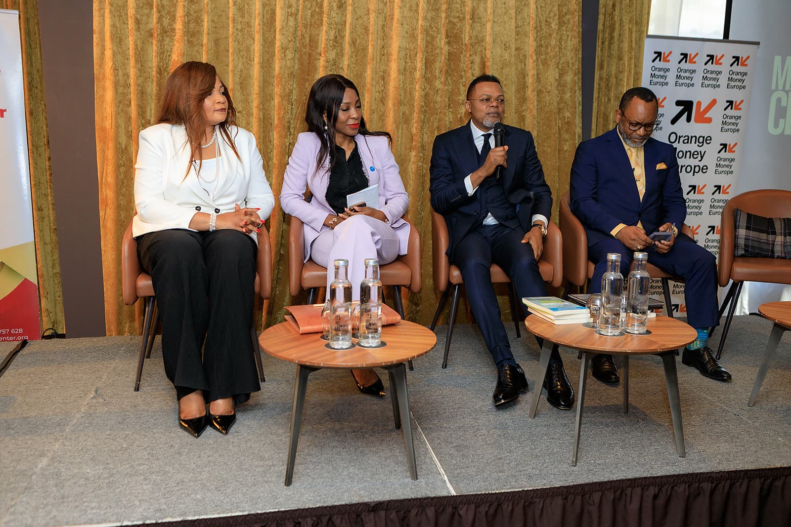Panel discussion with institutional partners at a Diambilay Business Center forum.
